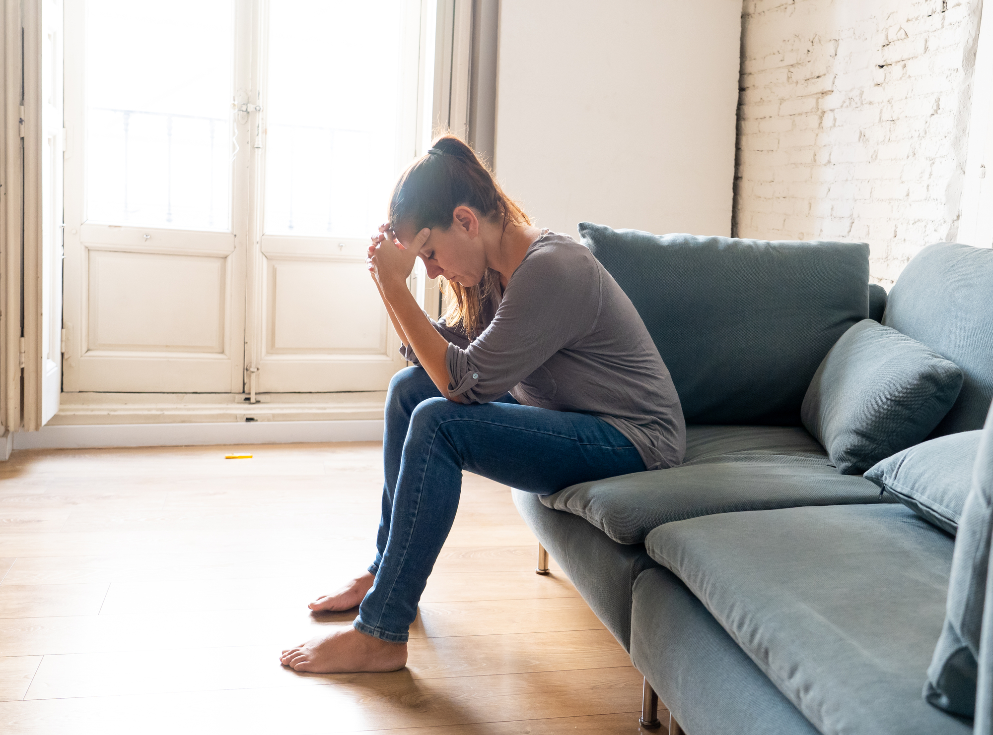 Filing A Claim For Emotional Distress - Young woman suffering from depression