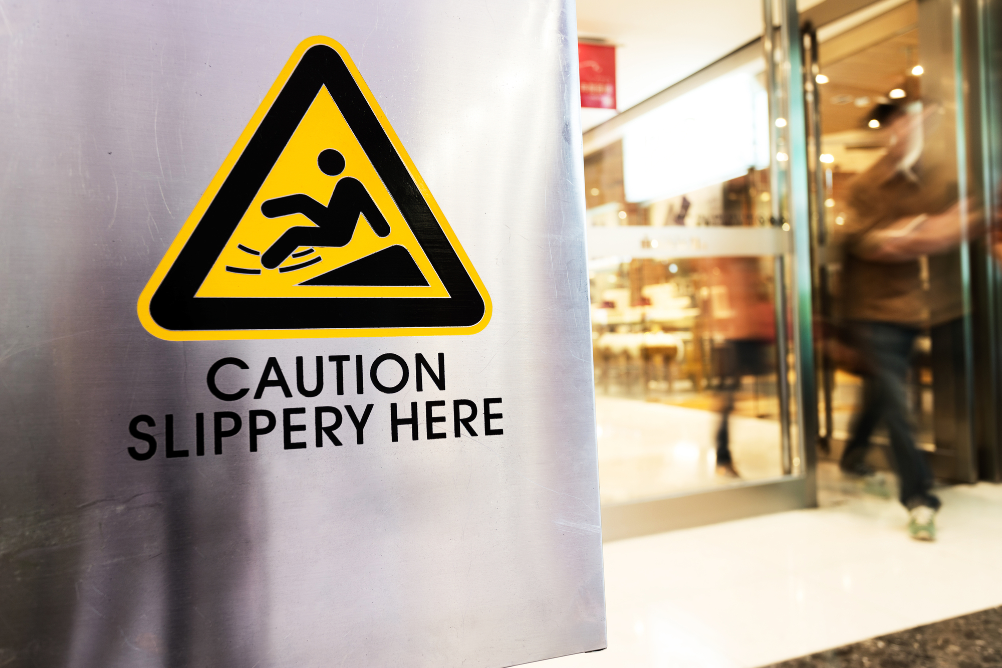 Slip And Fall Accidents: Factors And Injuries - caution sign at store
